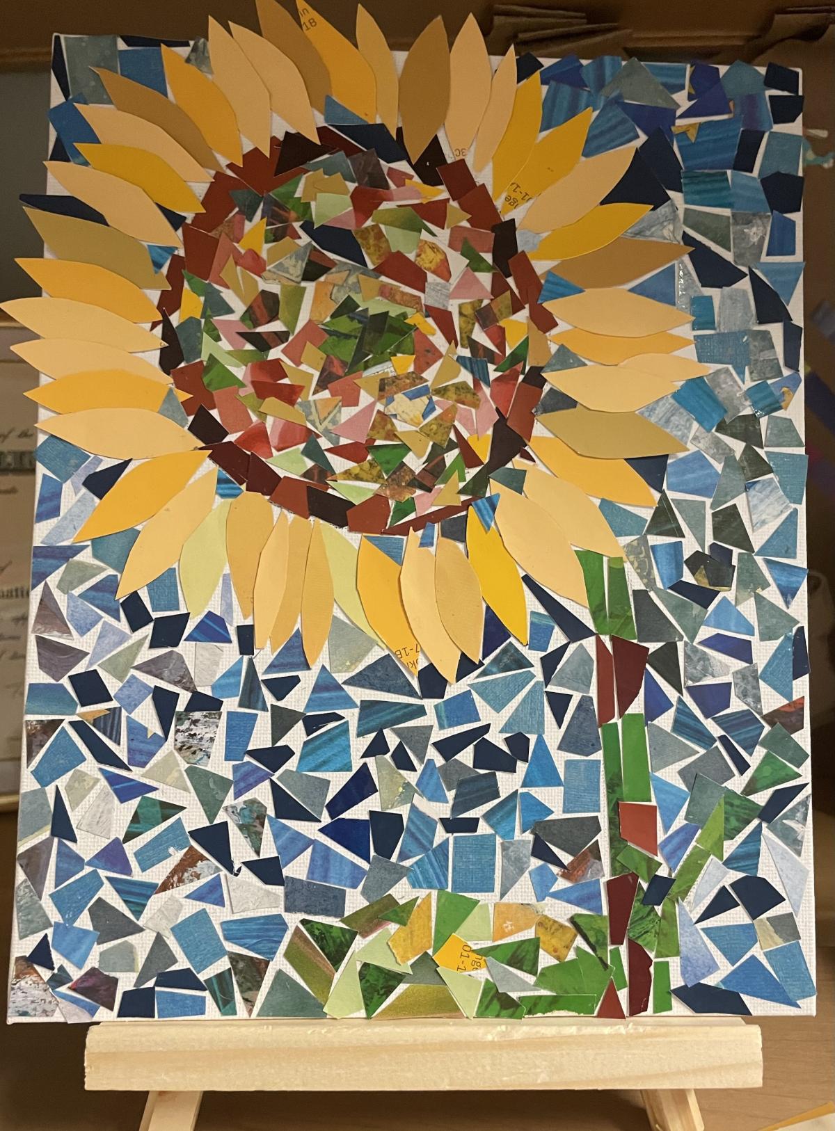 Photograph of paper mosaic of a sunflower.