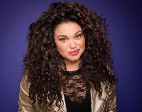 Color photograph of acress and author Michelle Buteau.